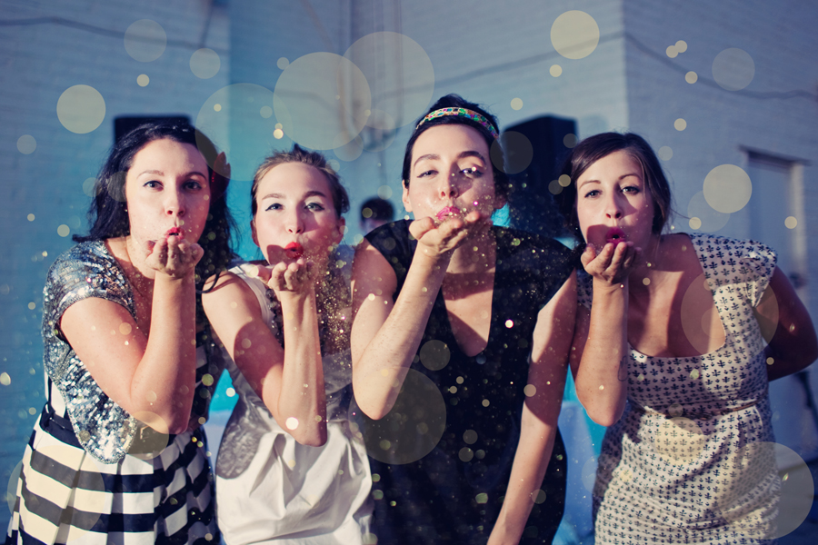 girls blowing glitter